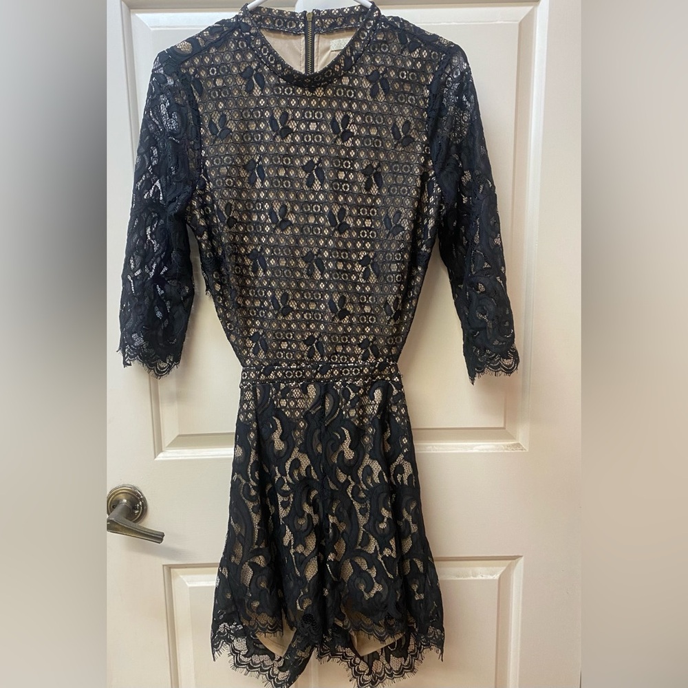 Beautiful dressy black lace romper with open back